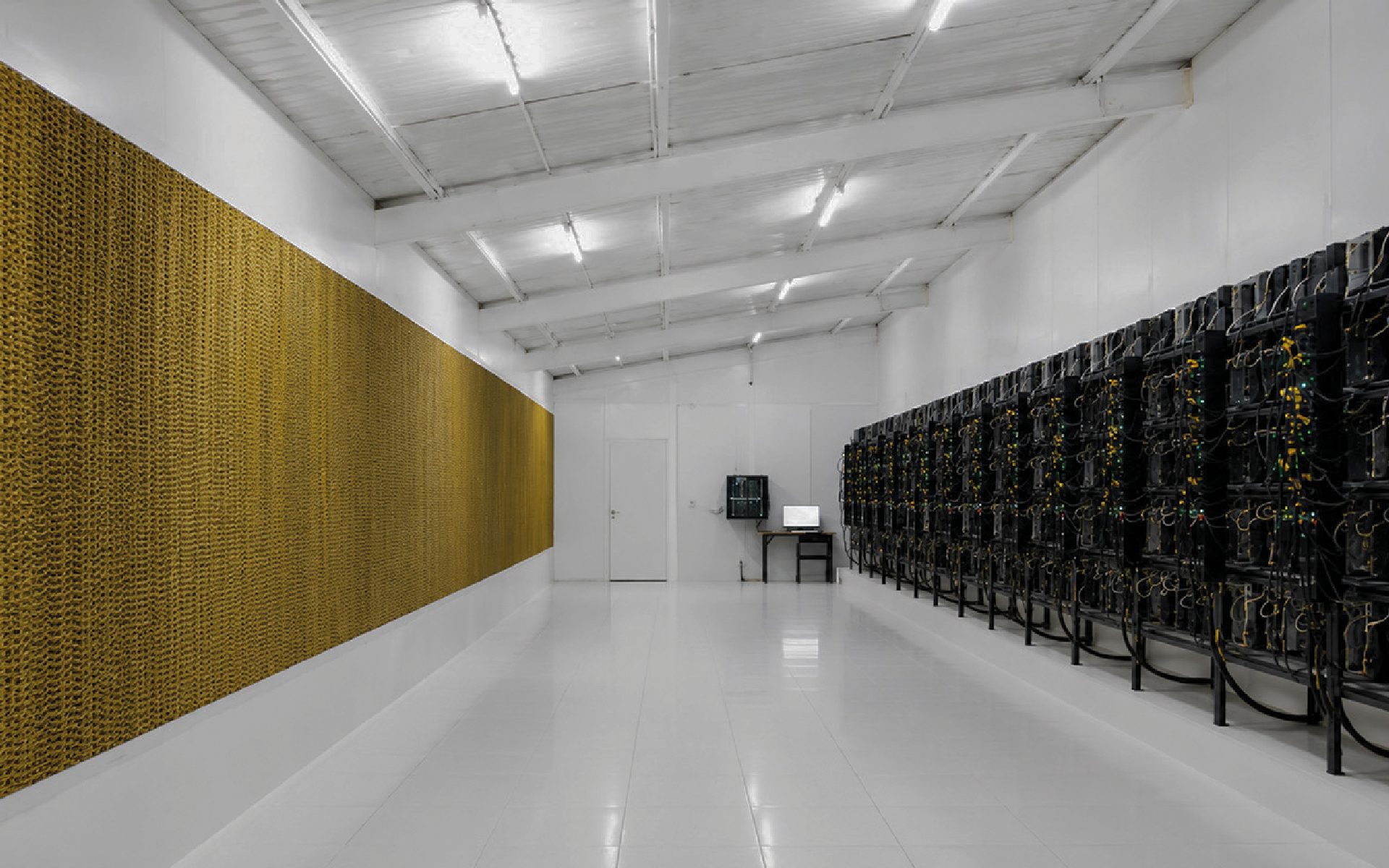 Data center interior with cooling wall and mining racks
