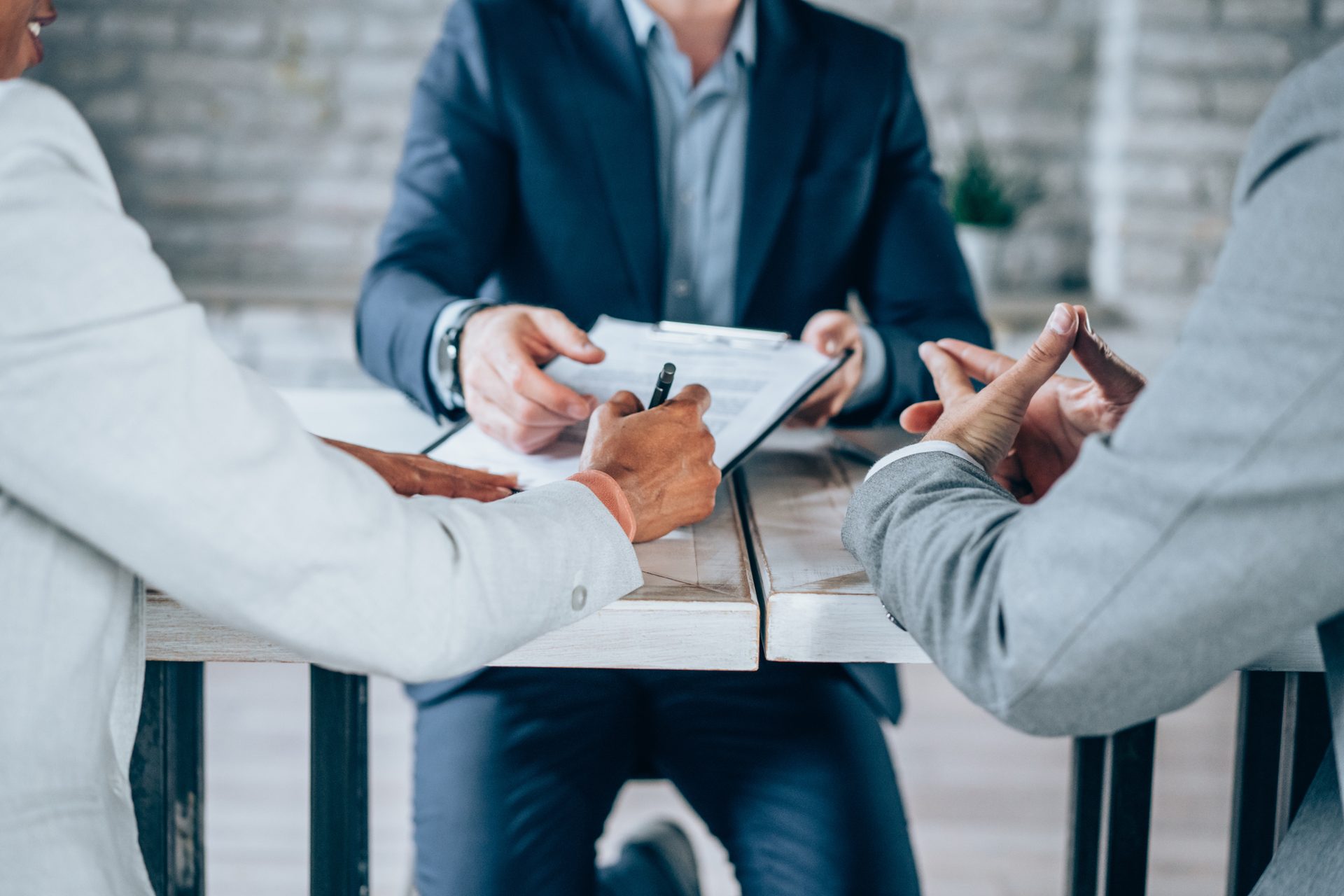 Two people discussing a contract