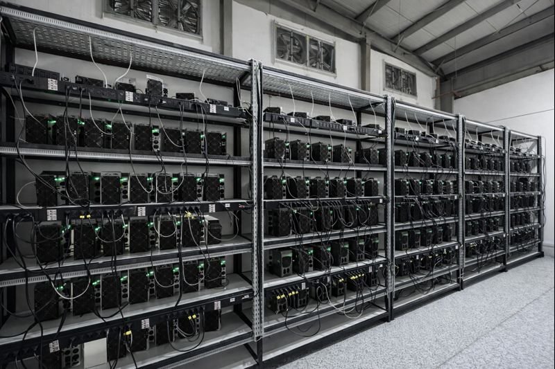 Rows of mining hardware racks